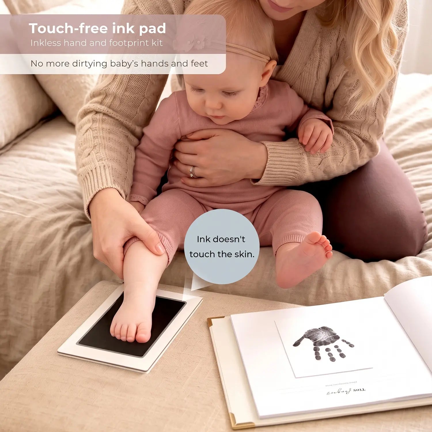 A mother pressing her baby's foot onto the touch-free ink pad included with the Hello Baby memory book, demonstrating a safe, mess-free inkless hand and footprint kit where ink never touches the skin.
