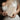 A clear size reference guide showing a bride holding the 4 by 6 inch Molekaus beige premium linen 'Her Vows' book against her lace dress, visually highlighting its 28-page capacity for extensive wedding promises.