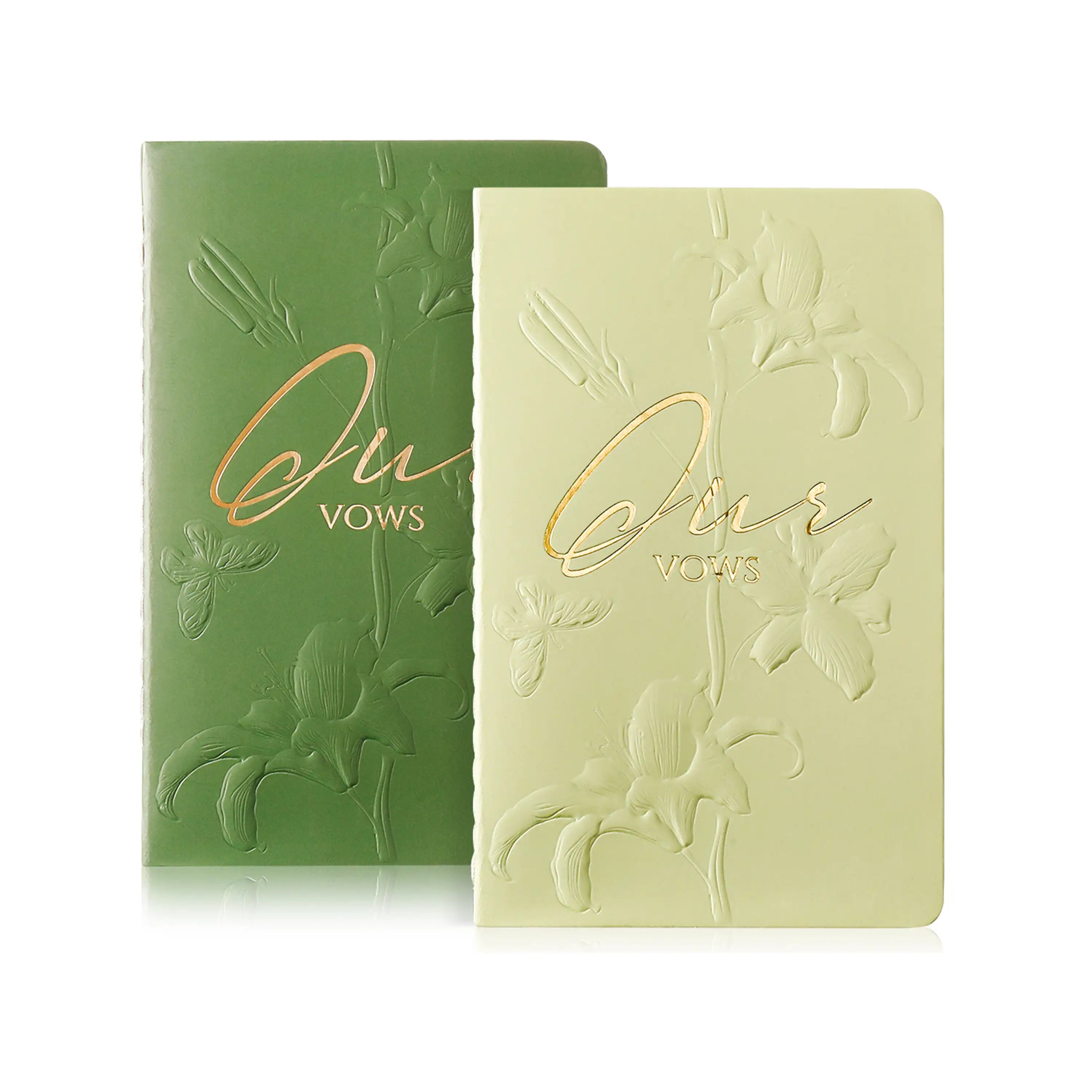 Molekaus gender-neutral 'Ours' wedding vow books in elegant sage and forest green with light-sensitive embossing.