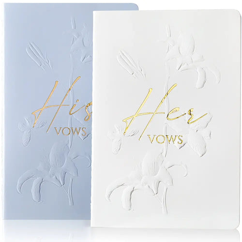 Molekaus floral embossed his and hers wedding vow books in crisp white and elegant blue.