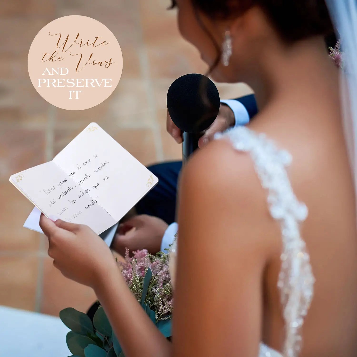 A bride viewed from behind speaking into a microphone during her wedding ceremony, reading her heartfelt promises from the open Molekaus vow book that displays its handwritten interior pages.