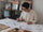 Close-up of a Molekaus designer sketching elegant botanical illustrations by hand with a pencil, showcasing our traditional, tool-free design process for our timeless journals.