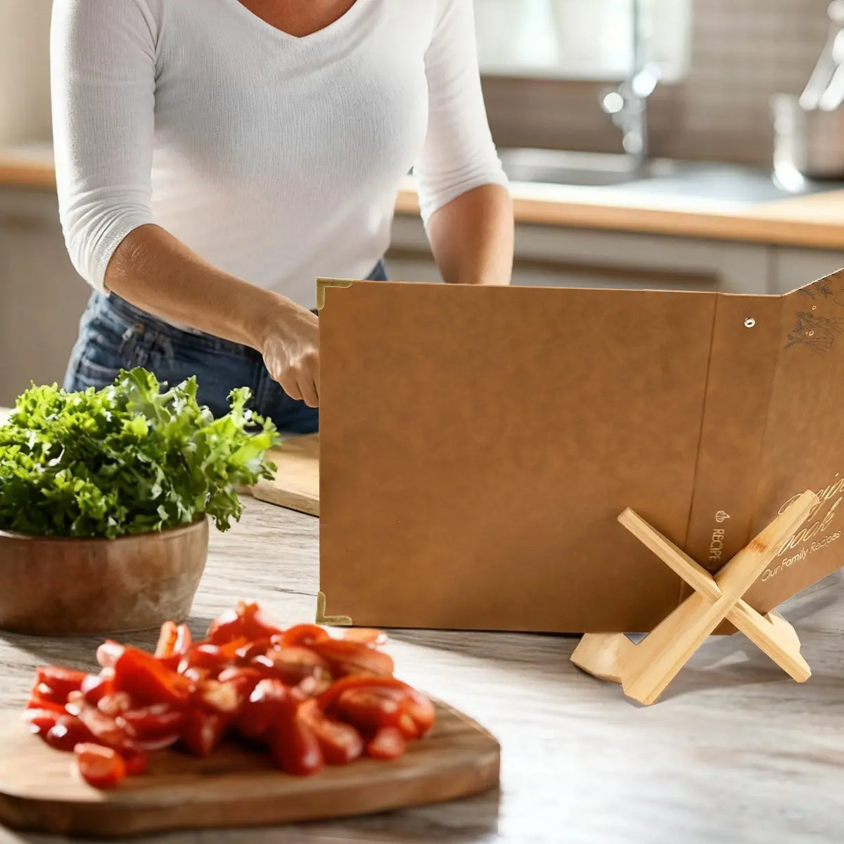 Molekaus premium leather recipe binder open on a rustic kitchen counter, showcasing its practical lay-flat design amidst fresh culinary ingredients.
