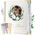 Close-up of the Molekaus spiral-bound wedding planner interior, showing organized section tabs for inspiration, guests, budget, and vendors.